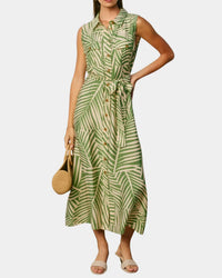 Wild tides shirt dress featuring a sleeveless green and cream palm leaf print with a fitted waist and matching belt