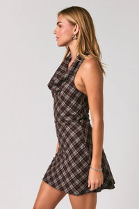 Halter neck open back plaid mini dress featuring a sleeveless ruched bodice in black and white plaid pattern