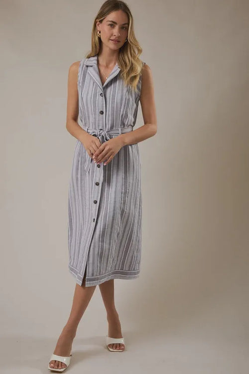 Sleeveless knee-length dress in light blue and white stripes with black buttons and a waist tie belt detail