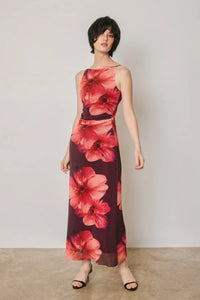 A flowing sleeveless maxi dress in deep burgundy with vibrant red floral prints featuring floral mesh open back detail