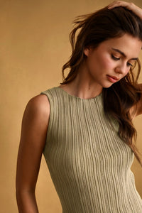 A sleeveless olive green viscose ribbed knitted dress with a round neckline ideal for boho chic clothing