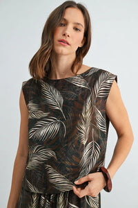 A sleeveless wide shoulder top in sheer dark brown fabric with an intricate white and black leaf print wide design