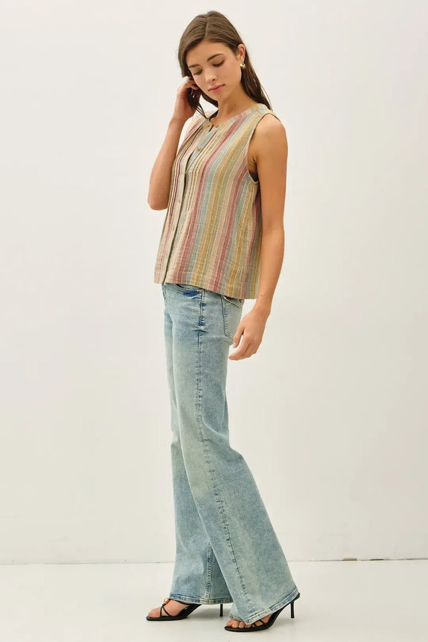 A sleeveless multi-color striped gauze top with vertical stripes in soft pastel tones made from lightweight fabric