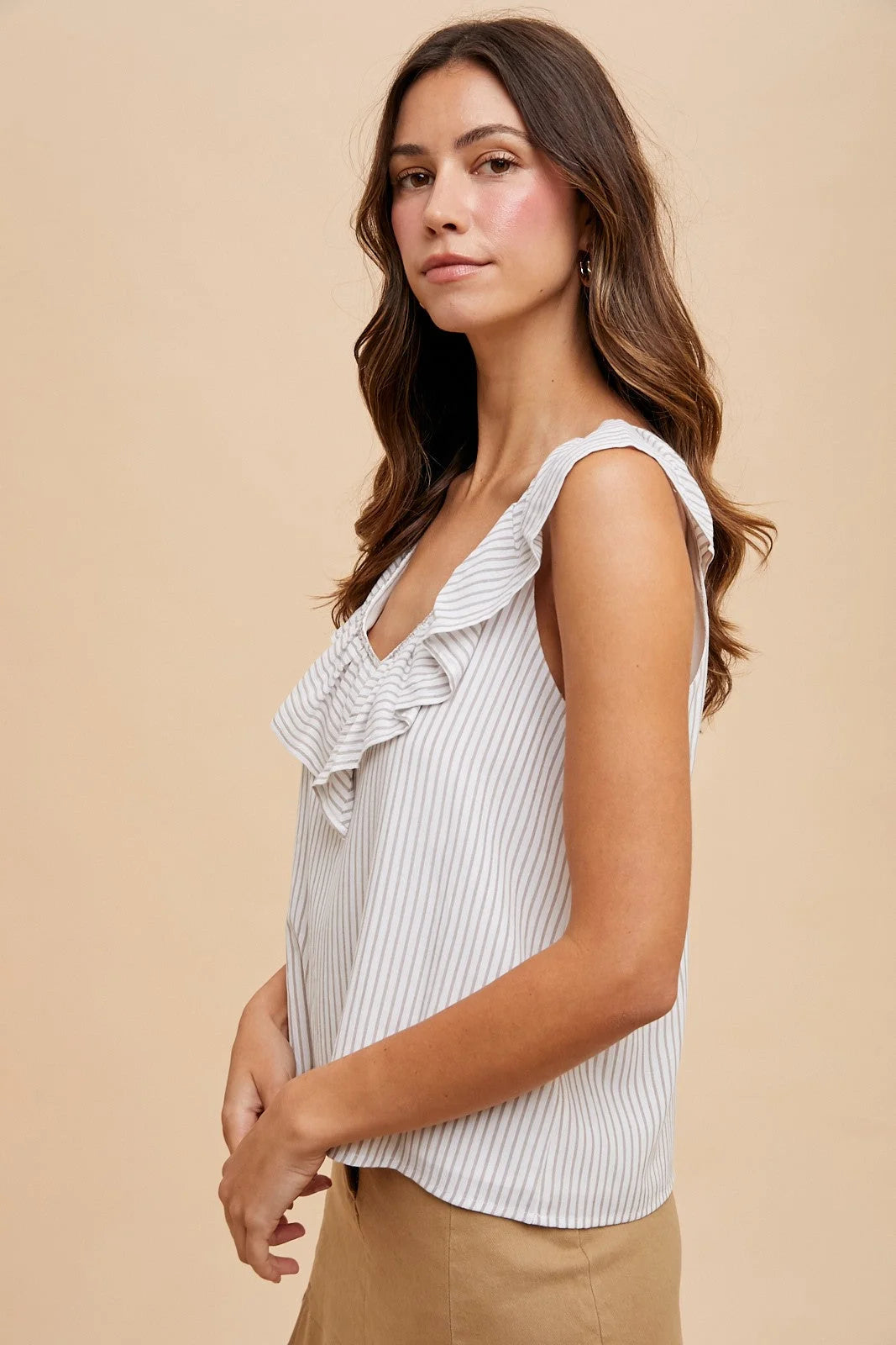 Pin stripe ruffled V neck blouse with white and light gray vertical stripes