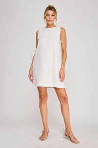 Linen blend sleeveless shift mini dress in white with relaxed fit and subtle frayed neckline detailing