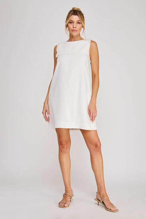 Linen blend sleeveless shift mini dress in white with relaxed fit and subtle frayed neckline detailing
