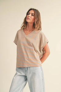 A soft beige and brown v-neck t-shirt with a striped pattern short sleeve design for casual wear