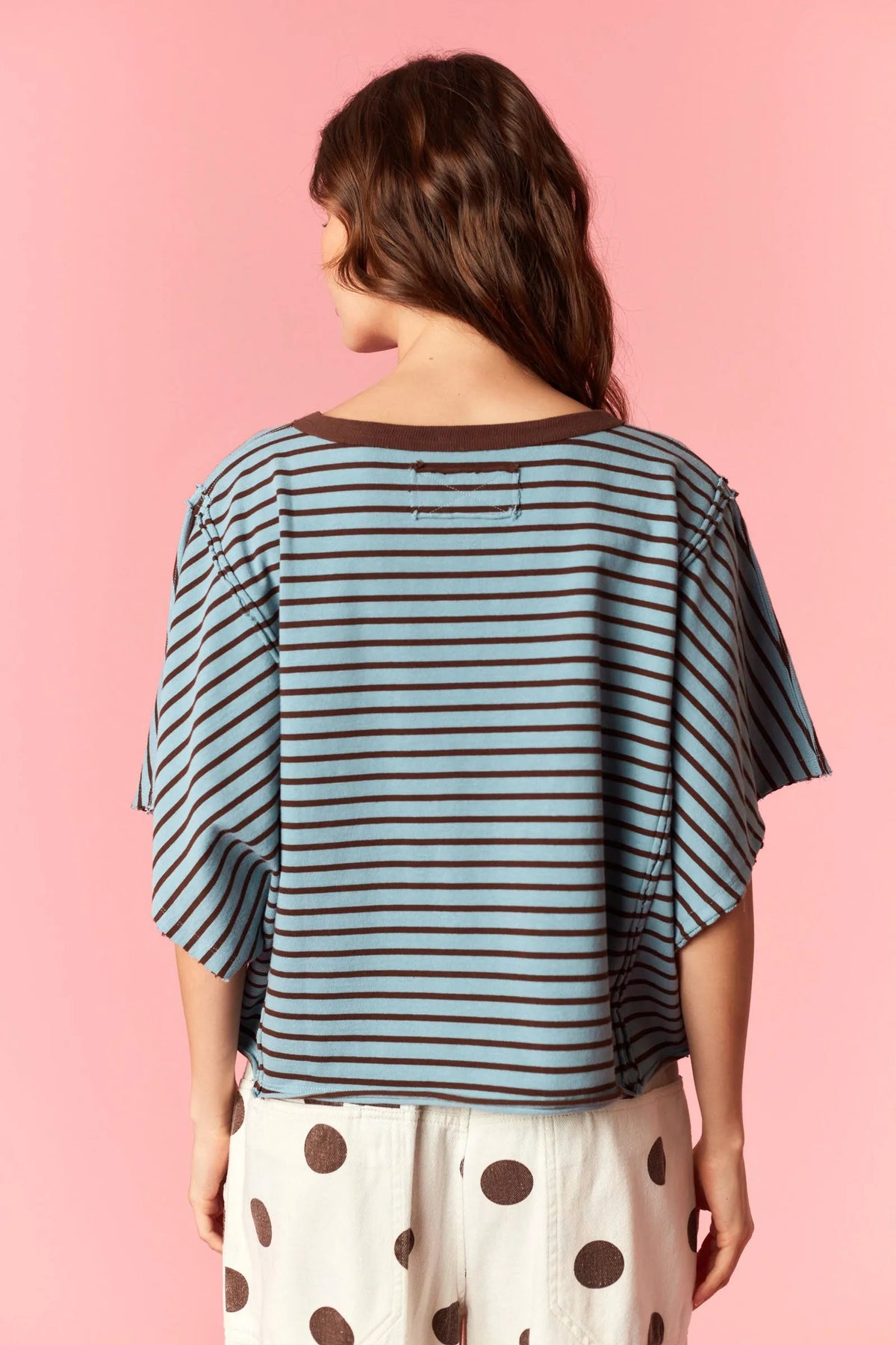 A soft blue and brown yarn dyed stripe round neck tee with a relaxed flowing silhouette made of breathable fabric