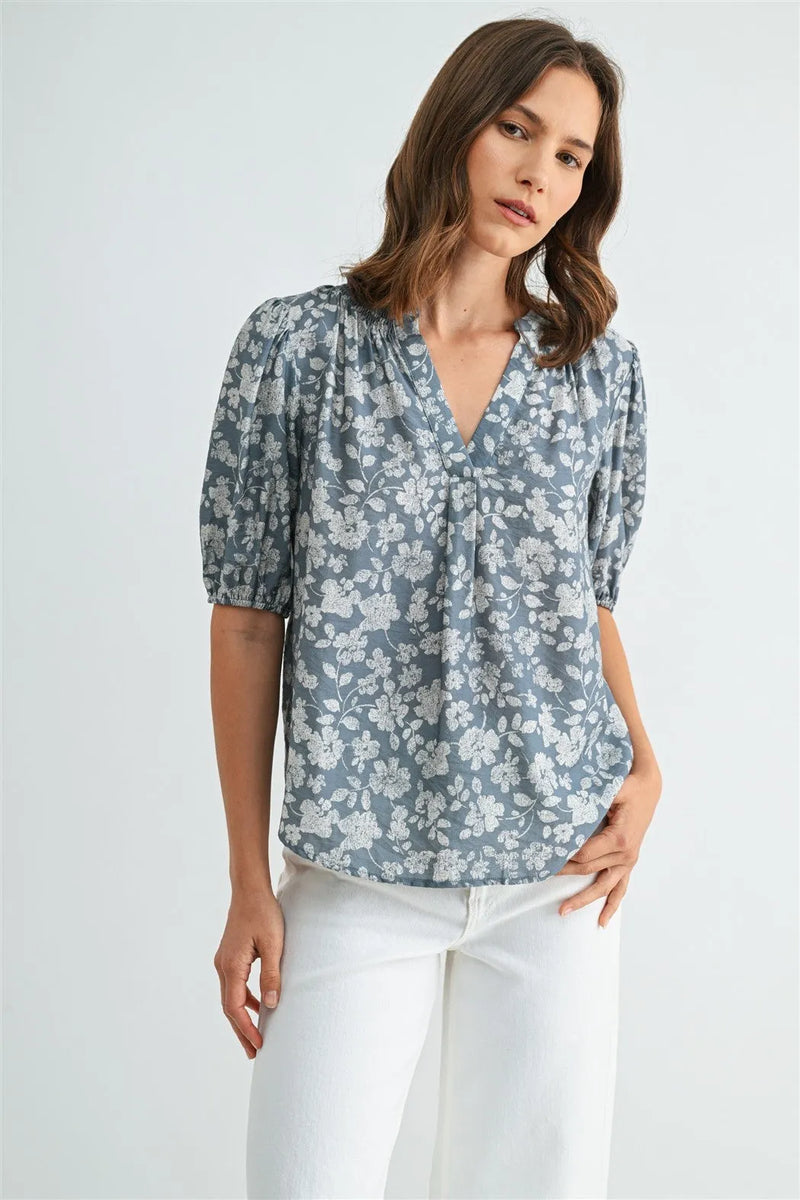 Soft blue v-neck smocking blouse with puffed sleeves in women’s boho chic clothing available at shop Daisy