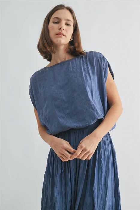 Crinkle satin elastic hem top in soft flowing blue linen with pleated skirt