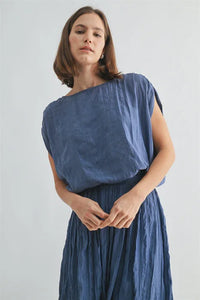 Crinkle satin elastic hem top in soft flowing blue linen with pleated skirt