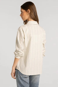 A cream-colored thread and supply lexington shirt with delicate vertical stripes and rolled sleeves in soft fabric