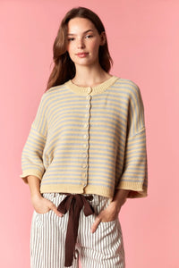 A cream and light blue striped knit cardigan with a button front featuring a curly edge oversized design