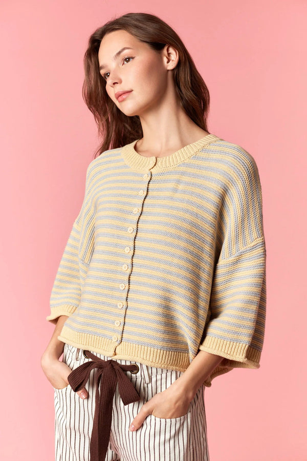 A soft knitted yellow and light blue thin stripe curly edge oversized cardigan with button closure