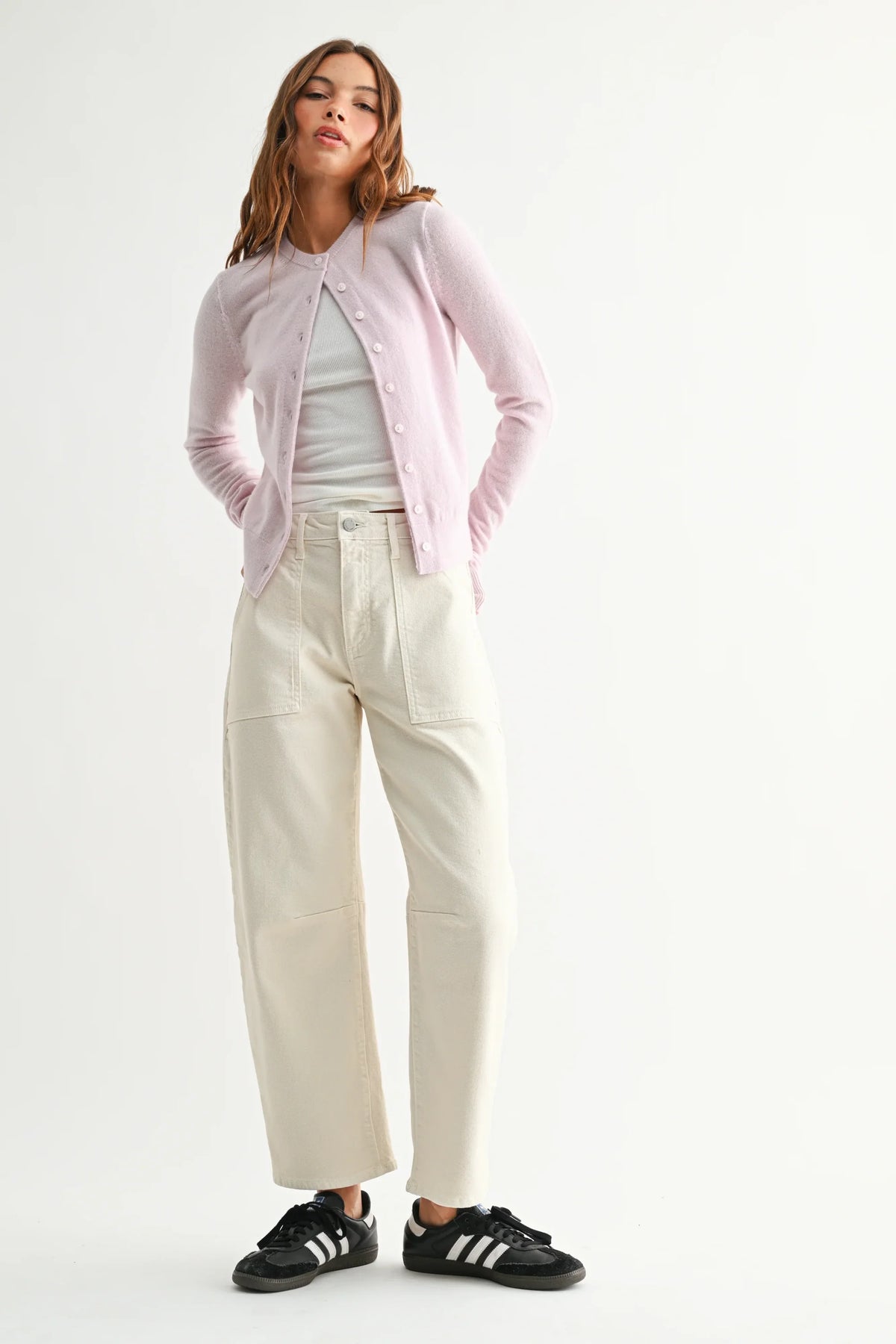 Soft lavender knit cardigan over white top with utility seamed barrel jean