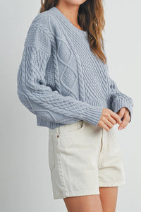 Casual solid cable knit sweater in soft light blue with textured pattern