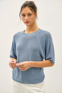 Lightweight ribbed knit raglan short sleeve top in soft light blue with relaxed fit and breathable fabric