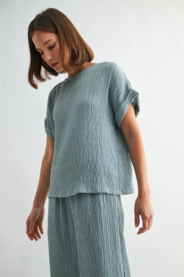 Texture dolman sleeve woven top in soft light blue textured fabric