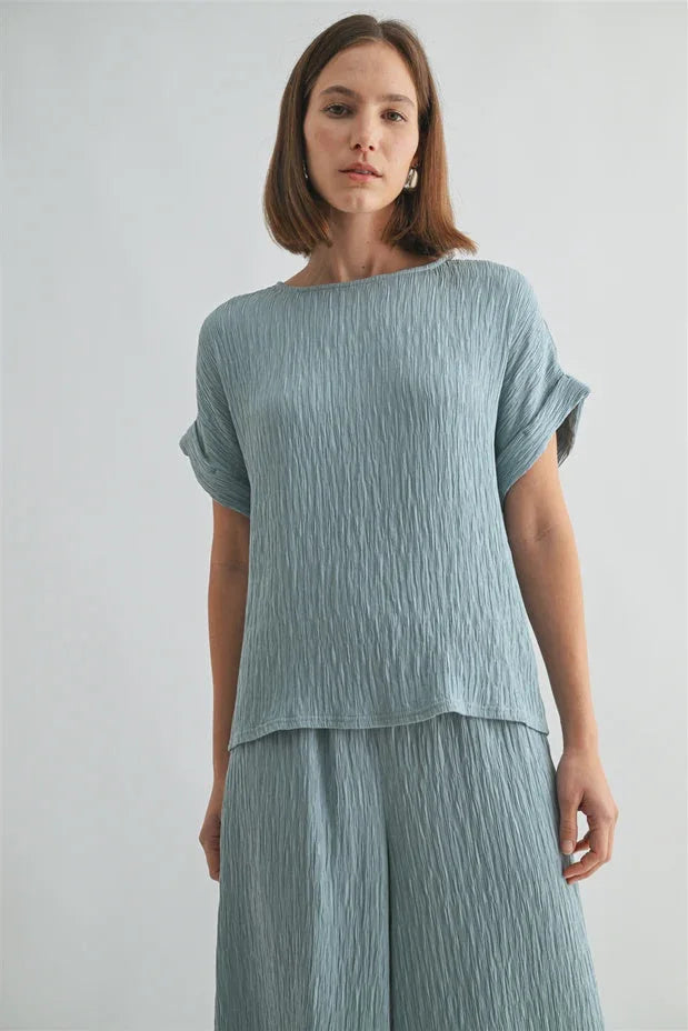 Texture dolman sleeve woven top in soft light blue pleated fabric