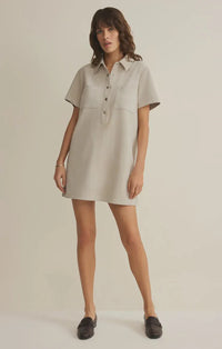 A soft light gray danna faux suede mini dress with short sleeves collar and front button closure