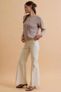 A soft light gray round neck wool ribbed cardigan with long sleeves and a subtle textured pattern