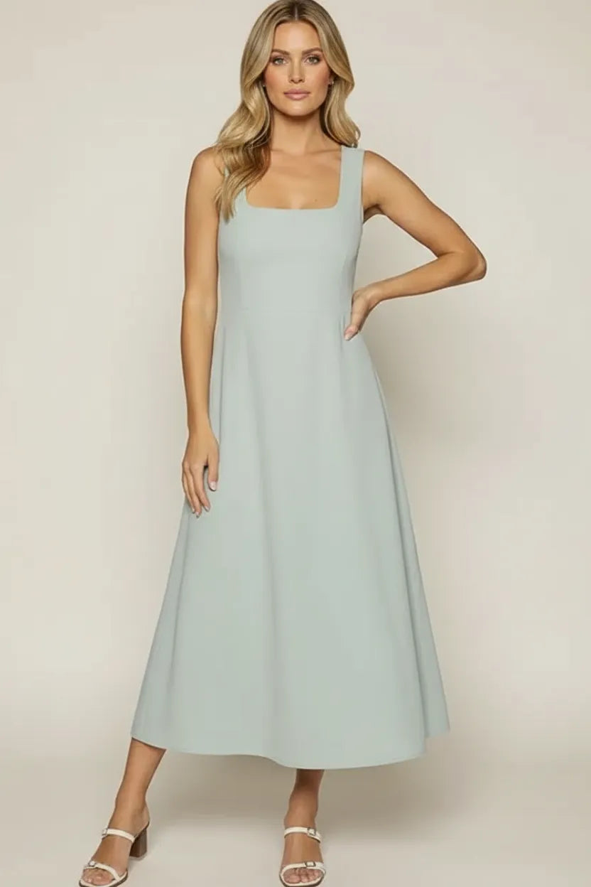 A soft mint green sleeveless vista marina maxi dress with square neckline and flowing a-line silhouette