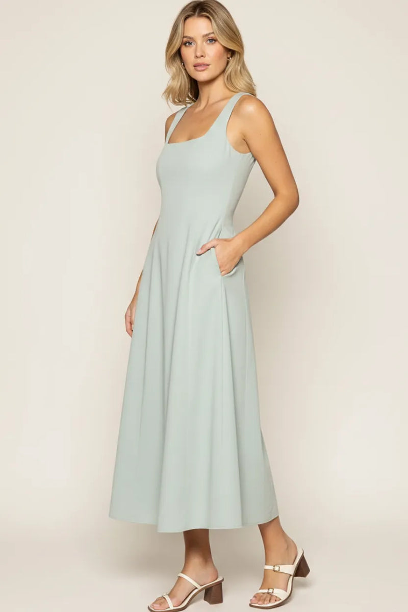 A soft mint green sleeveless vista marina maxi dress with square neckline and side pockets by lost + wander