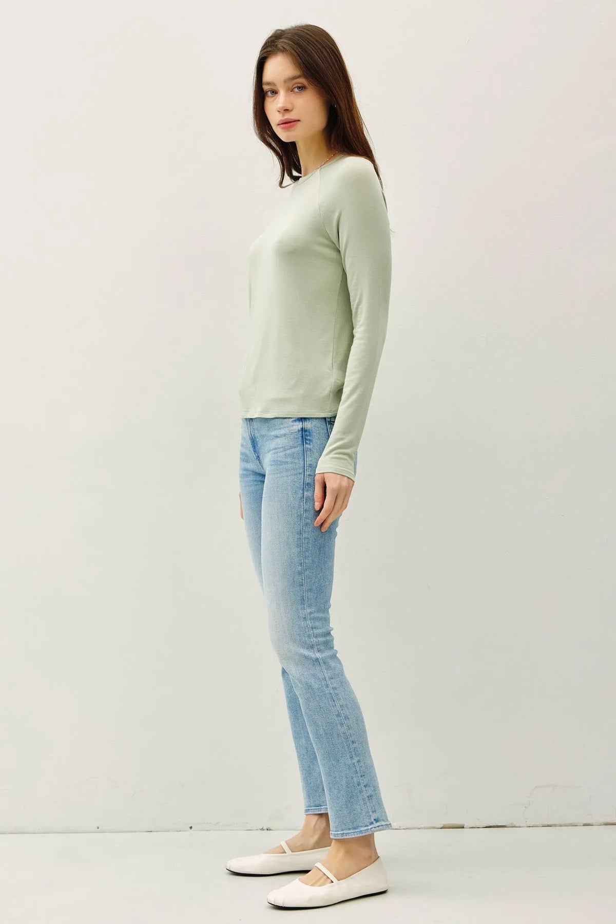 A soft mint green modal raglan sleeve layering basic top with long sleeves and a simple round neckline in stretchy fabric
