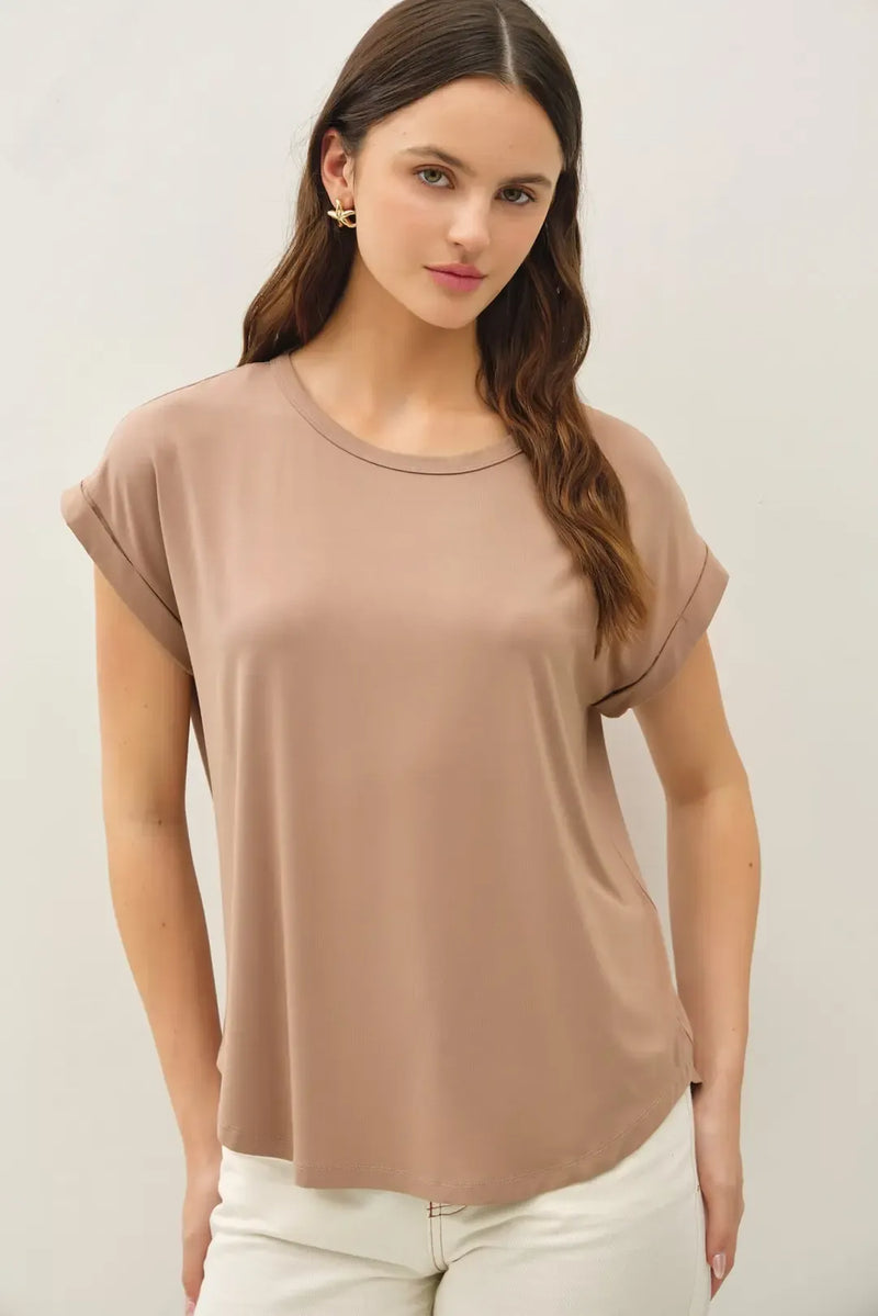 A soft muted beige bamboo round neck cap sleeve top with relaxed fit and rolled cuffs