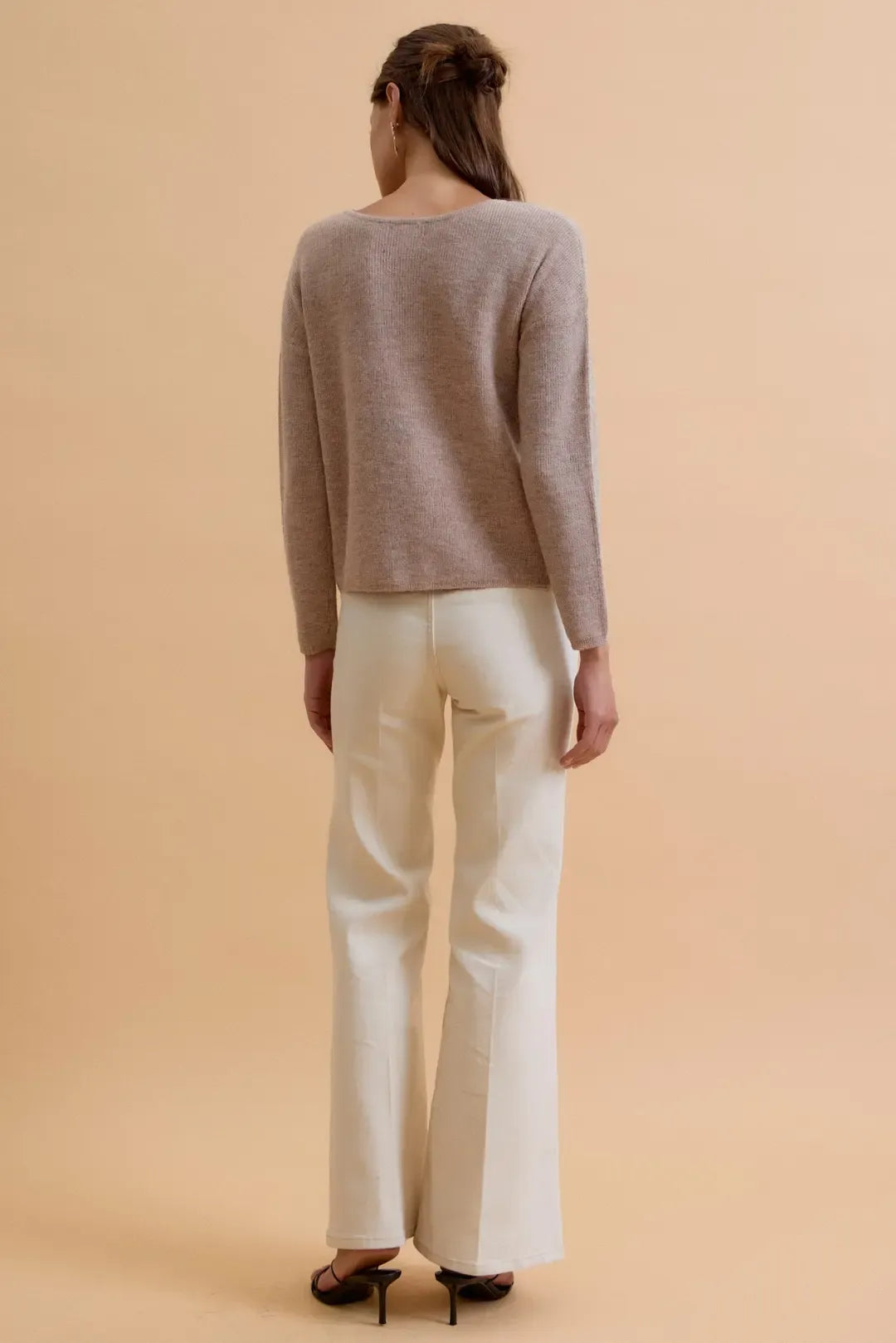 A soft muted gray round neck wool ribbed cardigan with relaxed fit long sleeves made from wool ribbed material
