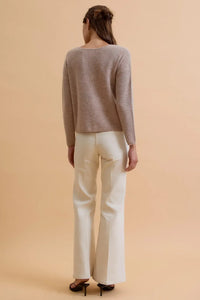 A soft muted gray round neck wool ribbed cardigan with relaxed fit long sleeves made from wool ribbed material