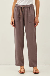 Soft muted taupe tencel tapered pants with wide-leg fit drawstring waist and two front pockets