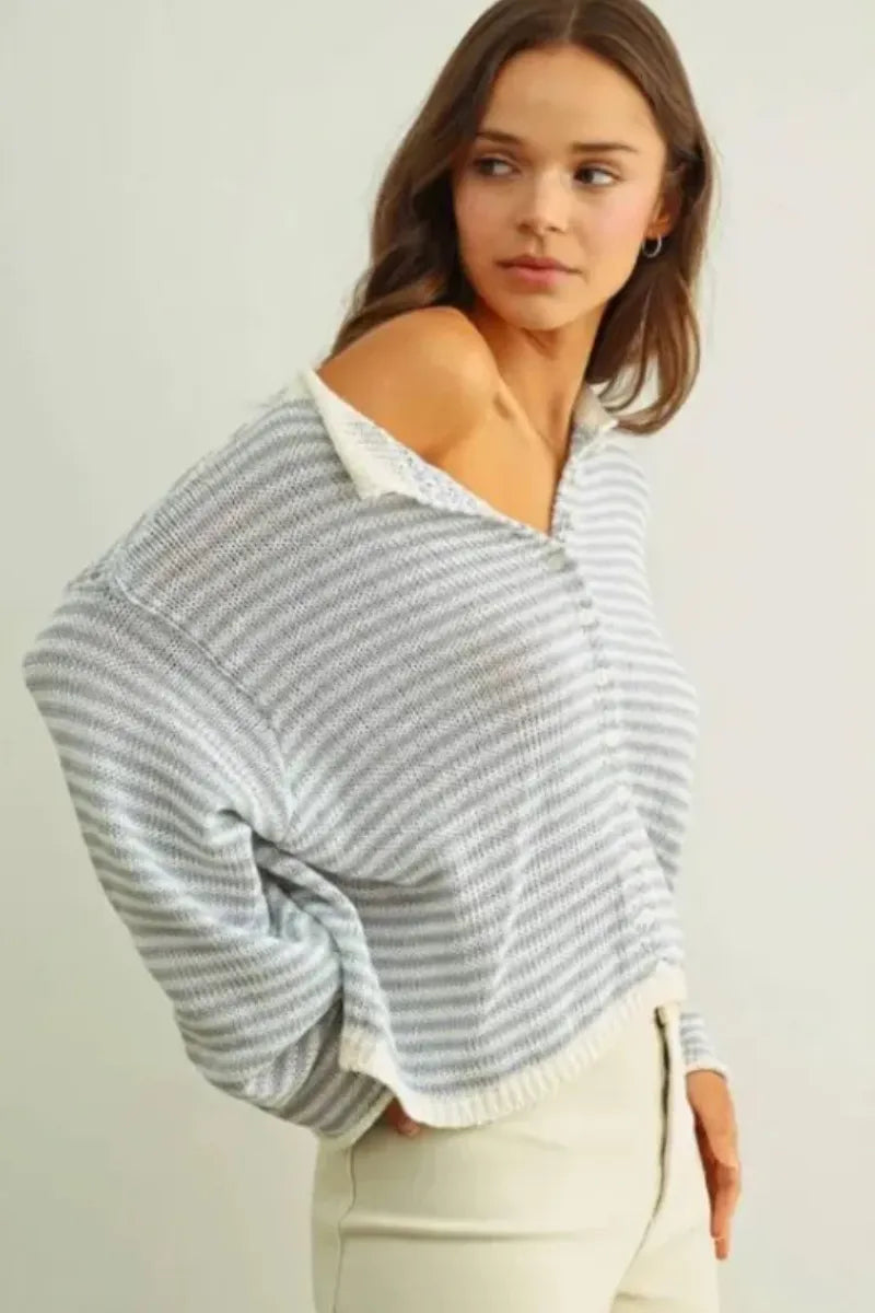 A soft off-the-shoulder stripe button knit cardigan with horizontal gray and white stripes and a lace collar