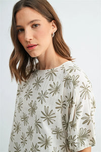 A soft off-white flower print dolman blouse with olive-green floral pattern and puffed sleeves