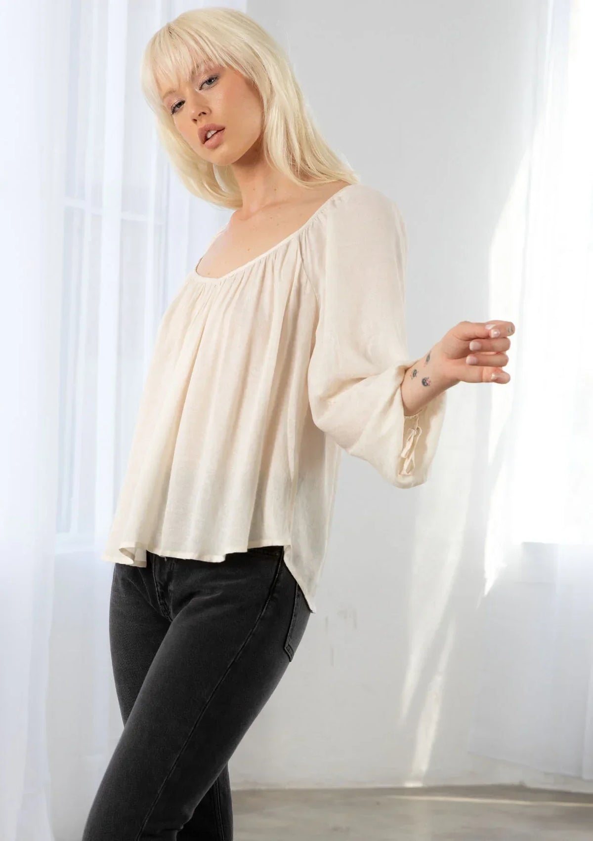 Bohemian long sleeve V neck floral top in soft off-white with gathered neckline