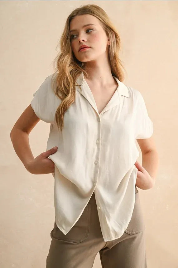 A soft off-white lightweight button cap sleeve shirt with short sleeves and a relaxed fit for casual wear