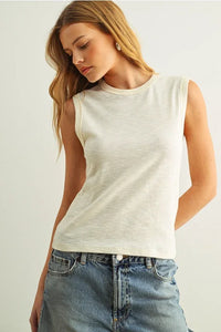 Sleeveless cotton round neck top in soft off-white relaxed fit