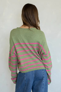 A soft olive green and vibrant pink quarter stripe piper pullover sweater in a relaxed oversized knit fit