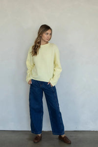 A soft pale yellow oversized soft piper pullover sweater with long sleeves and relaxed fit knit design
