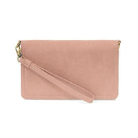A soft pink suede billie mini organizer crossbody bag with gold-tone hardware and matching wrist strap