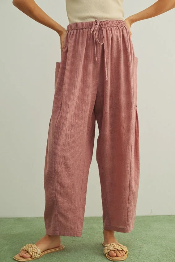Soft pink pinstriped loose pants with textured cotton, drawstring waist, pockets