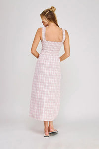 A soft pink and white plaid print smocked midi dress with a square neckline and thin shoulder straps