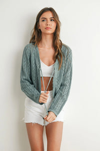 Soft sage green knitted tie-front cardigan with cable-knit pattern