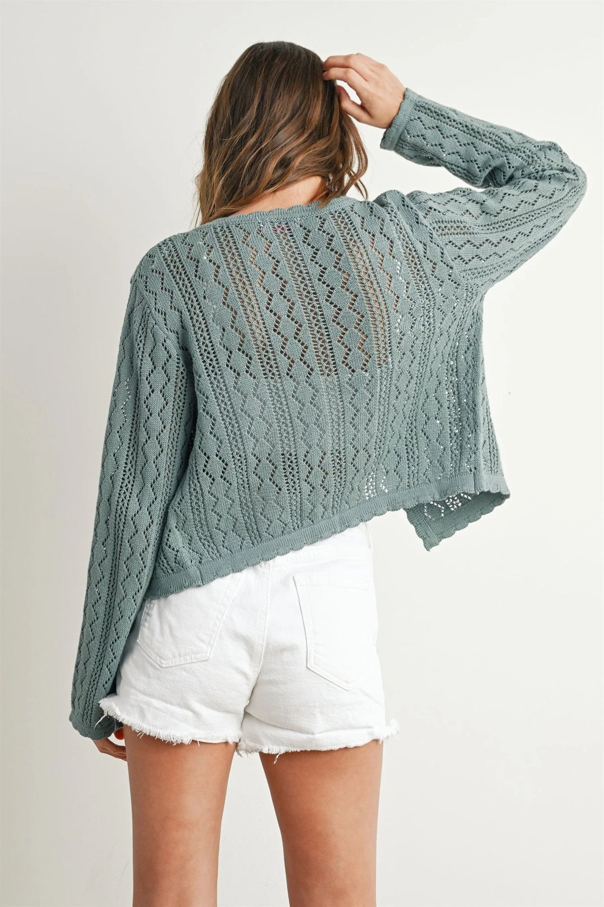 Soft sage green knitted tie-front cardigan with open-knit diamond pattern