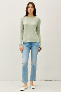 A soft sage green modal raglan sleeve layering basic top with long sleeves, round neckline, and ribbed cuffs