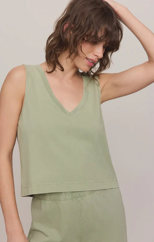 A soft sage green v neck cotton jersey tank top with a relaxed fit and sleeveless crop style