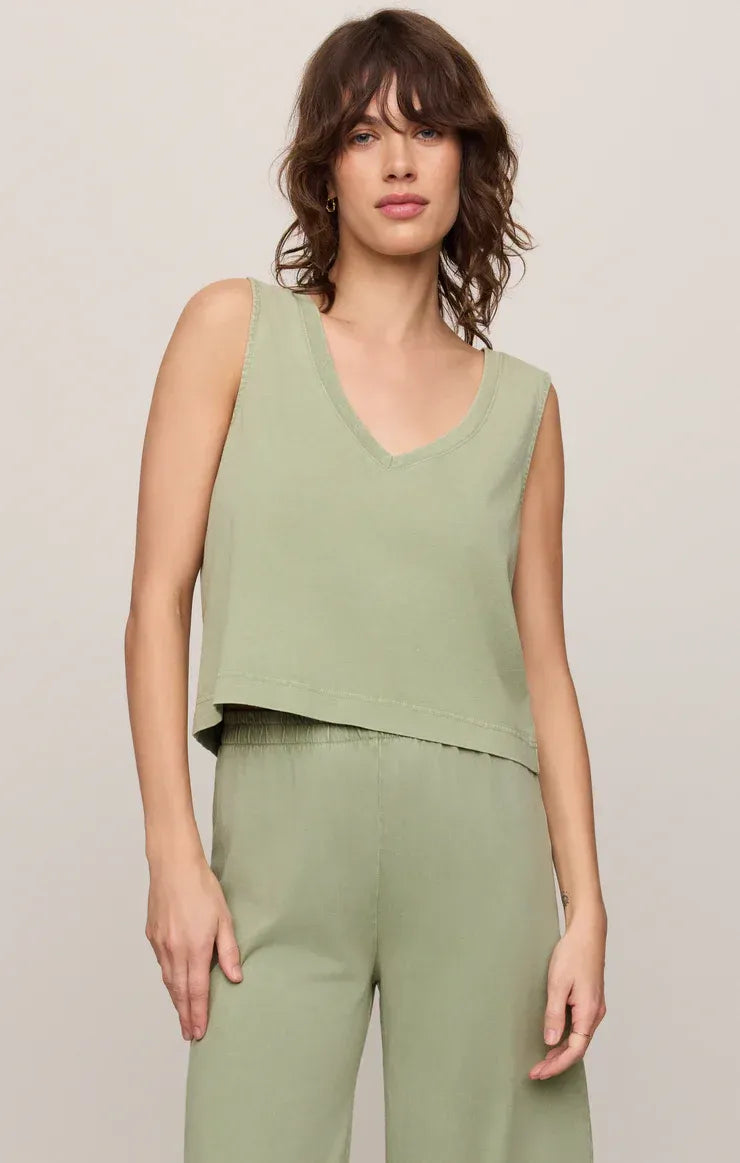 A soft sage green v neck cotton jersey tank top with sleeveless crop design and relaxed fit