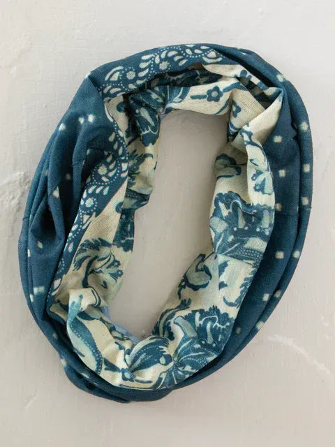 A soft stretchy infinity scarf in navy blue cream with intricate floral pattern for boho bandeau headband shibori stripe indigo
