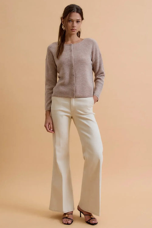 A soft taupe round neck wool ribbed cardigan with button-down front and subtle textured pattern