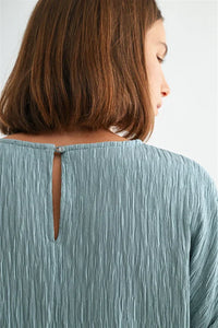 Texture dolman sleeve woven top in soft teal with back keyhole